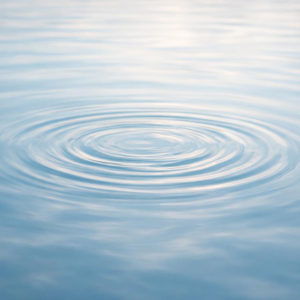 Concentric ripples on calm blue water